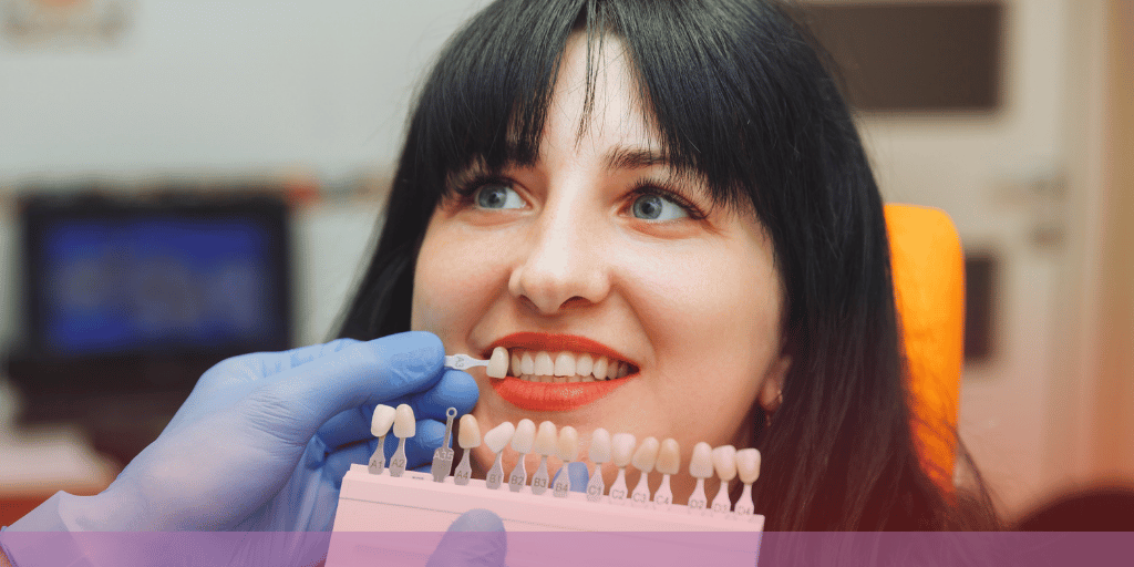 woman having her tooth color matched with a shade guide